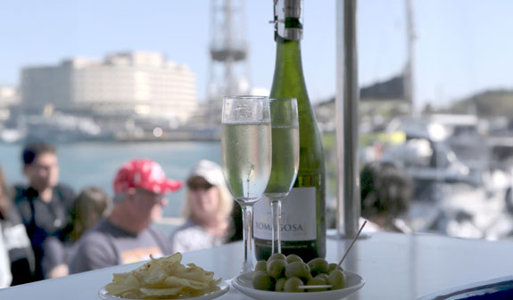 Las Golondrinas sailing in front of the coast of Barcelona