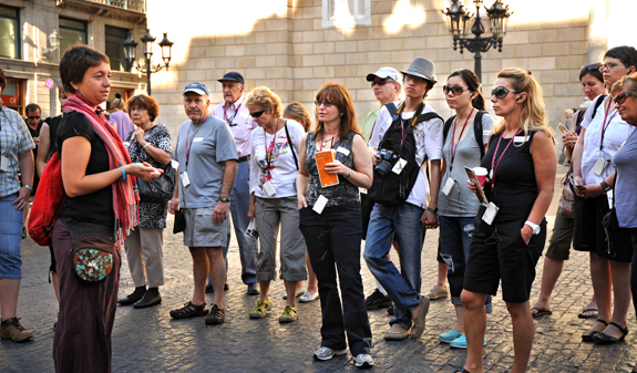 Tourist group listening the guide explanations in Barcelona