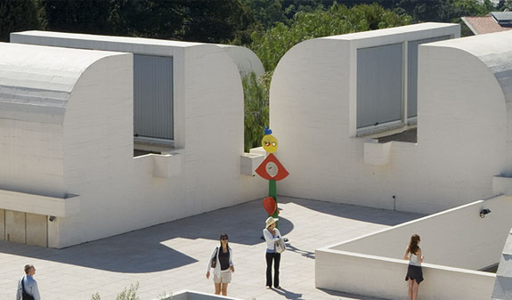 People looking at the sculptures on the Joan Miró Foundation roof in Barcelona