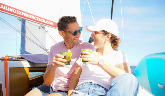 couple having a vermouth on a sailboat
