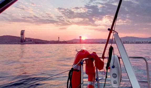 Sunset on a sailboat at sea