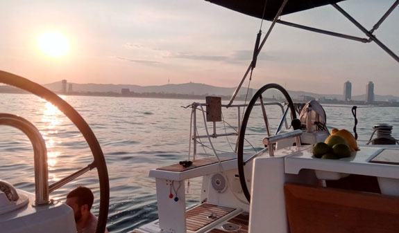 Sunset on a sailboat at sea